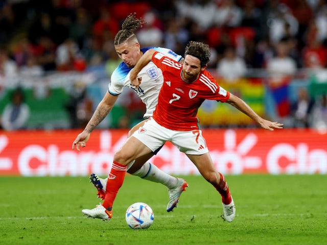 Joe Allen in action for Wales against England at the 2022 World Cup.