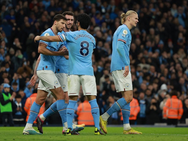 Manchester City's Ilkay Gundogan celebrates scoring their second goal with Manchester City's Ruben Dias, Aymeric Laporte and Erling Braut Haaland on February 12, 2023