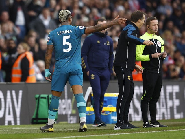 Wolverhampton Wanderers' Mario Lemina reacts after being sent off as Wolverhampton Wanderers manager Julen Lopetegui remonstrates with the fourth official on February 11, 2023