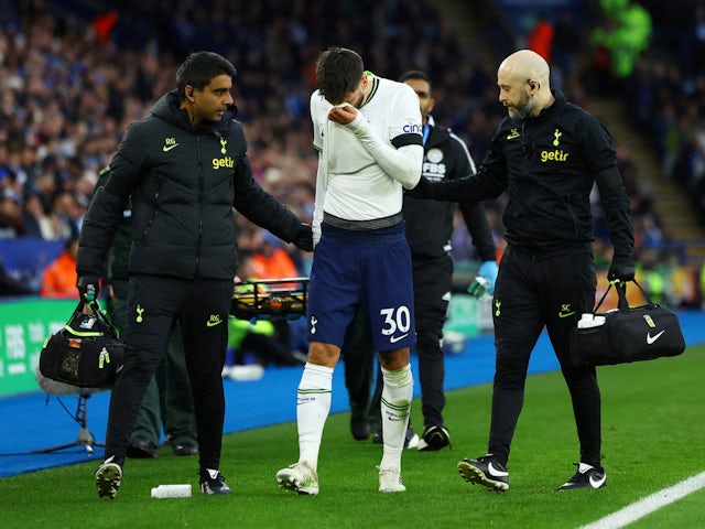 Tottenham Hotspur's Rodrigo Bentancur walks off the pitch after sustaining an injury on February 11, 2023