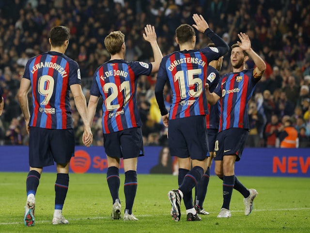 Barcelona's Sergi Roberto celebrates scoring their first goal with Frenkie de Jong, Andreas Christensen and Robert Lewandowski on February 19, 2023