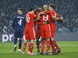 Bayern Munich's Kingsley Coman celebrates scoring their first goal with teammates on February 14, 2023