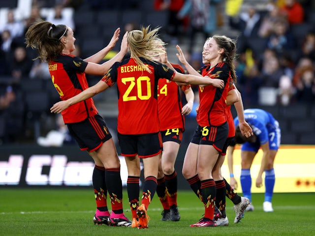 Belgium Women's Marie Detruyer celebrates scoring their first goal with teammates on February 16, 2023