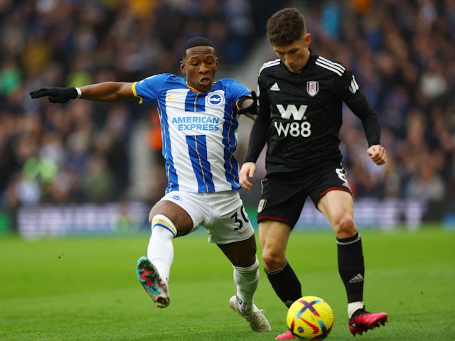 Brighton & Hove Albion's Pervis Estupinan in action with Fulham's Harry Wilson on February 18, 2023