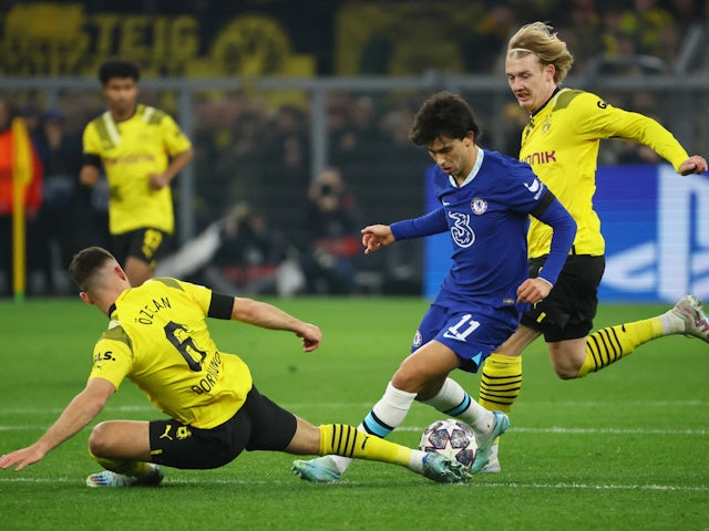 Chelsea's Joao Felix in action with Borussia Dortmund's Salih Ozcan and Julian Brandt on February 15, 2023
