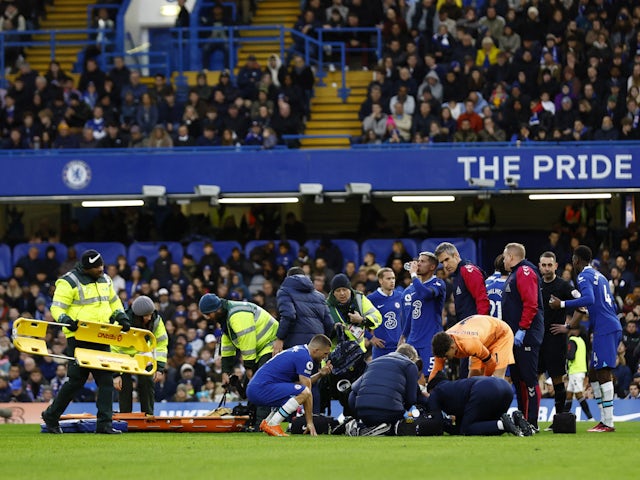 Chelsea's Cesar Azpilicueta receives medical attention after sustaining an injury from a challenge by Southampton's Sekou Mara on February 18, 2023