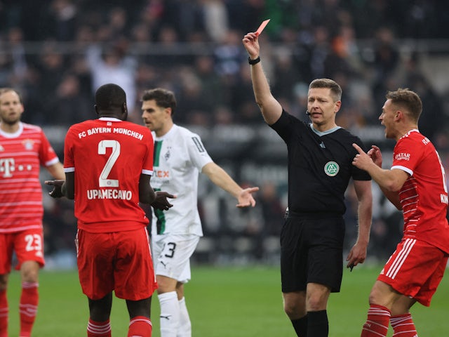 Bayern Munich's Dayot Upamecano is shown a red card by referee Tobias Welz on February 18, 2023