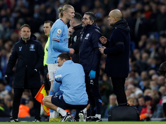Manchester City's Erling Braut Haaland receives medical attention on February 12, 2023