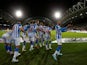 Huddersfield Town's Duane Holmes celebrates scoring their first goal with teammates on December 29, 2022