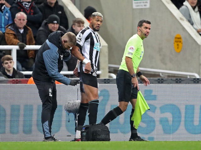 Newcastle United's Joelinton receives medical attention after sustaining an injury on February 18, 2023