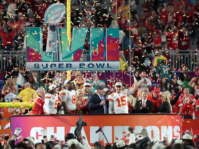 Kansas City Chiefs quarterback Patrick Mahomes (15) celebrates on the podium with the Vince Lombardi Trophy after the Kansas City Chiefs defeated the Philadelphia Eagles in Super Bowl LVII at State Farm Stadium on February 12, 2023