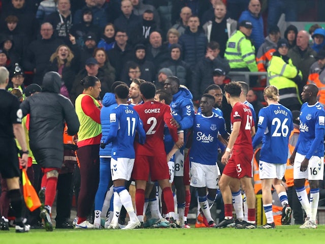 Liverpool and Everton players clash at the side of the pitch on February 13, 2023