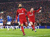 Liverpool's Mohamed Salah celebrates scoring their first goal with Andrew Robertson on February 13, 2023