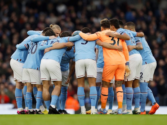 Manchester City players huddle before the match on February 12, 2023