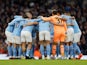 Manchester City players huddle before the match on February 12, 2023
