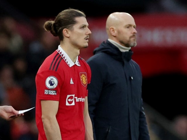 Manchester United's Marcel Sabitzer with manager Erik ten Hag as he prepares to come on as a substitute on February 4, 2023