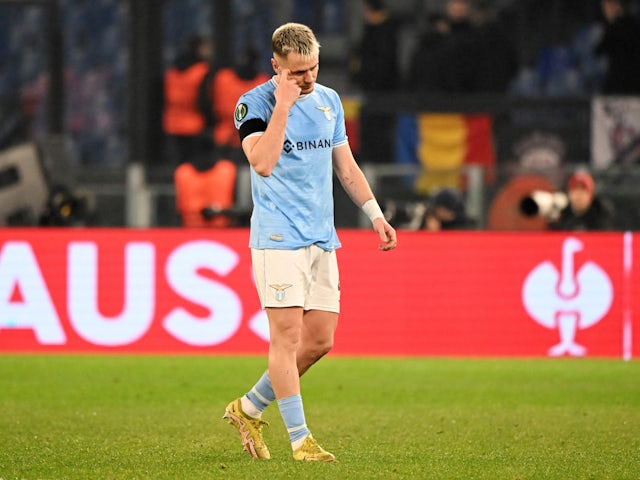 Lazio's Patric looks dejected as he walks of the pitch after receiving a a red card from referee Craig Pawson on February 16, 2023