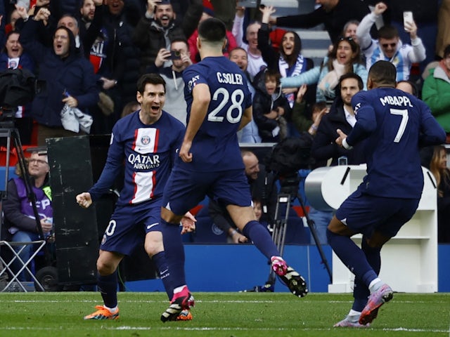 Paris Saint-Germain's (PSG) Lionel Messi celebrates scoring their fourth goal with Carlos Soler and Kylian Mbappe on February 19, 2023