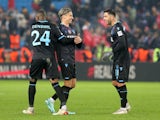 Trabzonspor's Jens Stryger Larsen celebrates with Anastasios Bakasetas and Stefano Denswil after the match on February 16, 2023