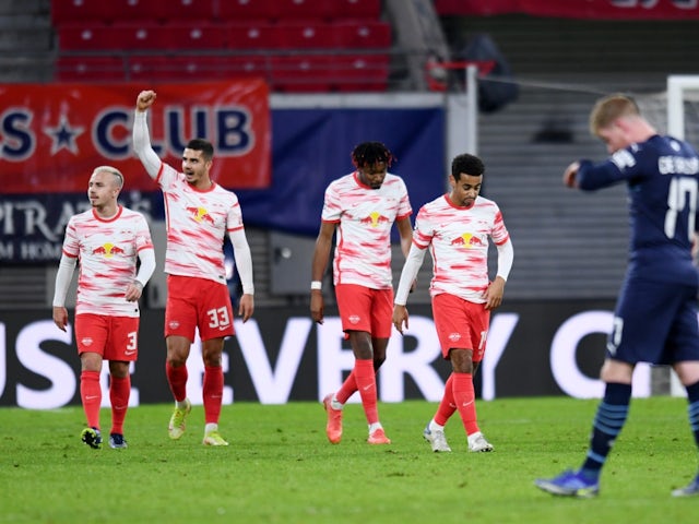 RB Leipzig's Andre Silva celebrates scoring their second goal with teammates on December 7, 2021