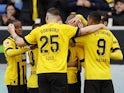 Borussia Dortmund players celebrate after Julian Brandt scores their first goal on February 25, 2023
