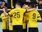 Borussia Dortmund players celebrate after Julian Brandt scores their first goal on February 25, 2023
