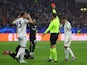 Eintracht Frankfurt's Randal Kolo Muani is shown a red card by referee Artur Soares Dias as Napoli's Giovanni Di Lorenzo and Amir Rrahmani react on February 21, 2023