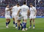 France's Romain Ntamack celebrates scoring their first try with teammates on February 26, 2023