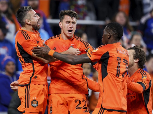 Houston Dynamo defender Tate Schmitt (22) celebrates with teammates after scoring a goal against FC Cincinnati in the first half at TQL Stadium on February 25, 2023