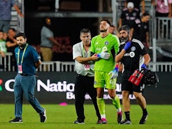 CF Montreal goalkeeper James Pantemis (41) is helped off the field after being injured in a play against Inter Miami CF during the second half at DRV PNK Stadium on February 25, 2023