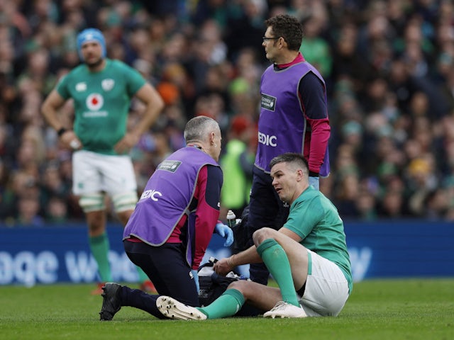 Ireland's Johnny Sexton receives medical attention after sustaining an injury on February 11, 2023