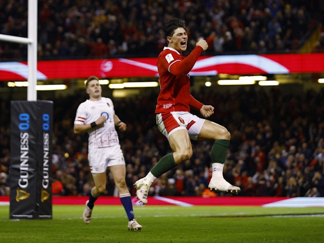 Wales' Louis Rees-Zammit celebrates scoring their first try against England on February 25, 2023