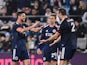 New England Revolution midfielder Matt Polster (8) and midfielder Noel Buck (29) and defender Dave Romney (2) celebrate after the game at Bank of America Stadium on February 25, 2023