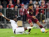  Bayer Leverkusen's Odilon Kossounou in action with Bayern Munich's Jamal Musiala on February 26, 2023