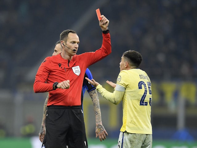 Porto's Otavio is shown a red card by referee Srdjan Jovanovic after receiving two yellow cards on February 22, 2023