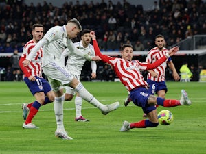 Real Madrid fight back to secure point against 10-man Atletico
