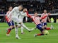 Real Madrid fight back to secure point against 10-man Atletico Madrid