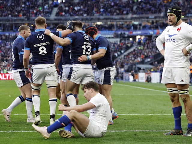 Scotland's Huw Jones celebrates scoring their second try with teammates on February 26, 2023