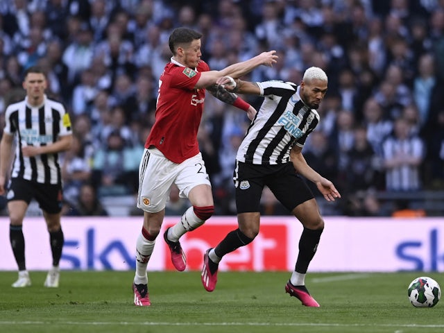 Manchester United's Wout Weghorst in action with Newcastle United's Joelinton on February 26, 2023