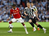 Manchester United's Fred in action with Newcastle United's Sean Longstaff on February 26, 2023