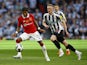 Manchester United's Fred in action with Newcastle United's Sean Longstaff on February 26, 2023