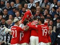 Manchester United players celebrate Casemiro's goal against Newcastle United on February 26, 2023