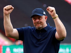 Bromley manager Andy Woodman celebrates winning the FA Trophy after the match on May 22, 2022