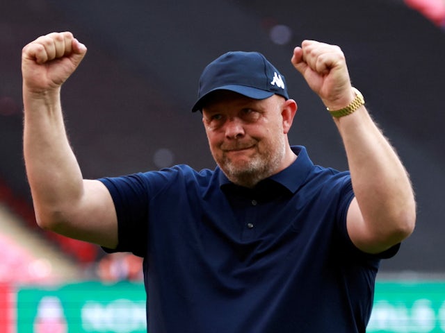 Bromley manager Andy Woodman celebrates winning the FA Trophy after the match on May 22, 2022