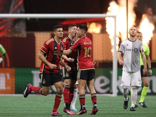 Atlanta United midfielder Matheus Rossetto (20) celebrates with teammates after scoring a goal against the Toronto FC during the second half at Mercedes-Benz Stadium on March 4, 2023