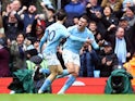 Bernardo Silva celebrates scoring for Manchester City with Phil Foden on March 4, 2023