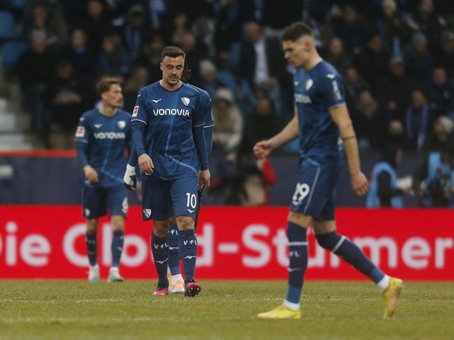 Bochum's Philipp Forster looks dejected after Schalke 04's Marius Bulter scores their second goal on March 4, 2023