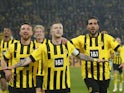 Borussia Dortmund's Marco Reus celebrates scoring their first goal with Salih Ozcan and Emre Can on March 3, 2023