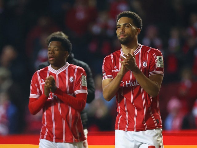 Bristol City's Zak Vyner and Bristol City's Omar Taylor-Clarke applaud fans after the match on February 28, 2023