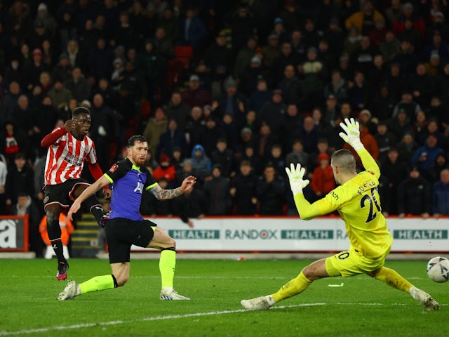  Tottenham Hotspur's Fraser Forster and Pierre-Emile Hojbjerg in action as Sheffield United's Ismaila Coulibaly shoots at goal on March 1, 2023